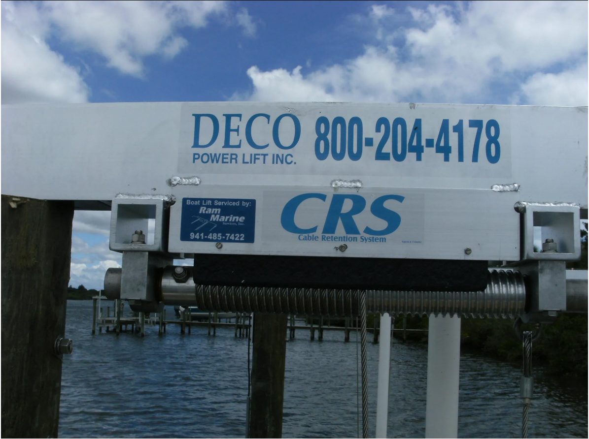 Cable retention system on a boat lift beam